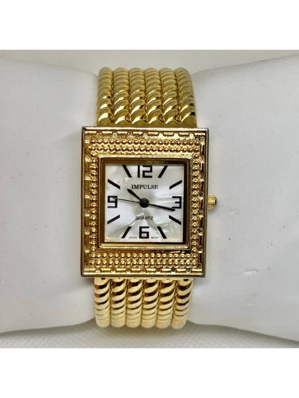 Impulse gold tone cuff bracelet women watch 28mm mop dial quartz 5.5” running